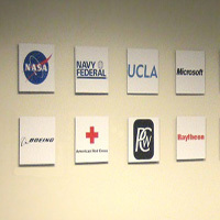 AtHoc uses fotoflōts to create a photo wall of customer logos. Businesses, government agencies and nonprofit organizations all use fotoflōts to tell their stories with photos.   fotoflōt displays images without picture frames, glass, mattes, or glare. Images float off the wall or desk and are held in place with magnets. fotoflōt can be used for photo display and to create photo collages, photo walls, diptychs and triptychs. fotoflōts can be created directly from images at Picasa, Kodak Gallery, SmugMug, Zenfolio, ACDSee and other online services.