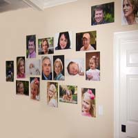 An organic family photo wall created by Ross Peebles. He integrated the wall switch and the door into the design of the family photo wall. fotoflōt displays images without picture frames, glass, mattes, or glare. Images float off the wall or desk and are held in place with magnets. fotoflōt can be used for photo display and to create photo collages, photo walls, diptychs and triptychs. fotoflōts can be created directly from images at Picasa, Kodak Gallery, SmugMug, Zenfolio, ACDSee and other online services.